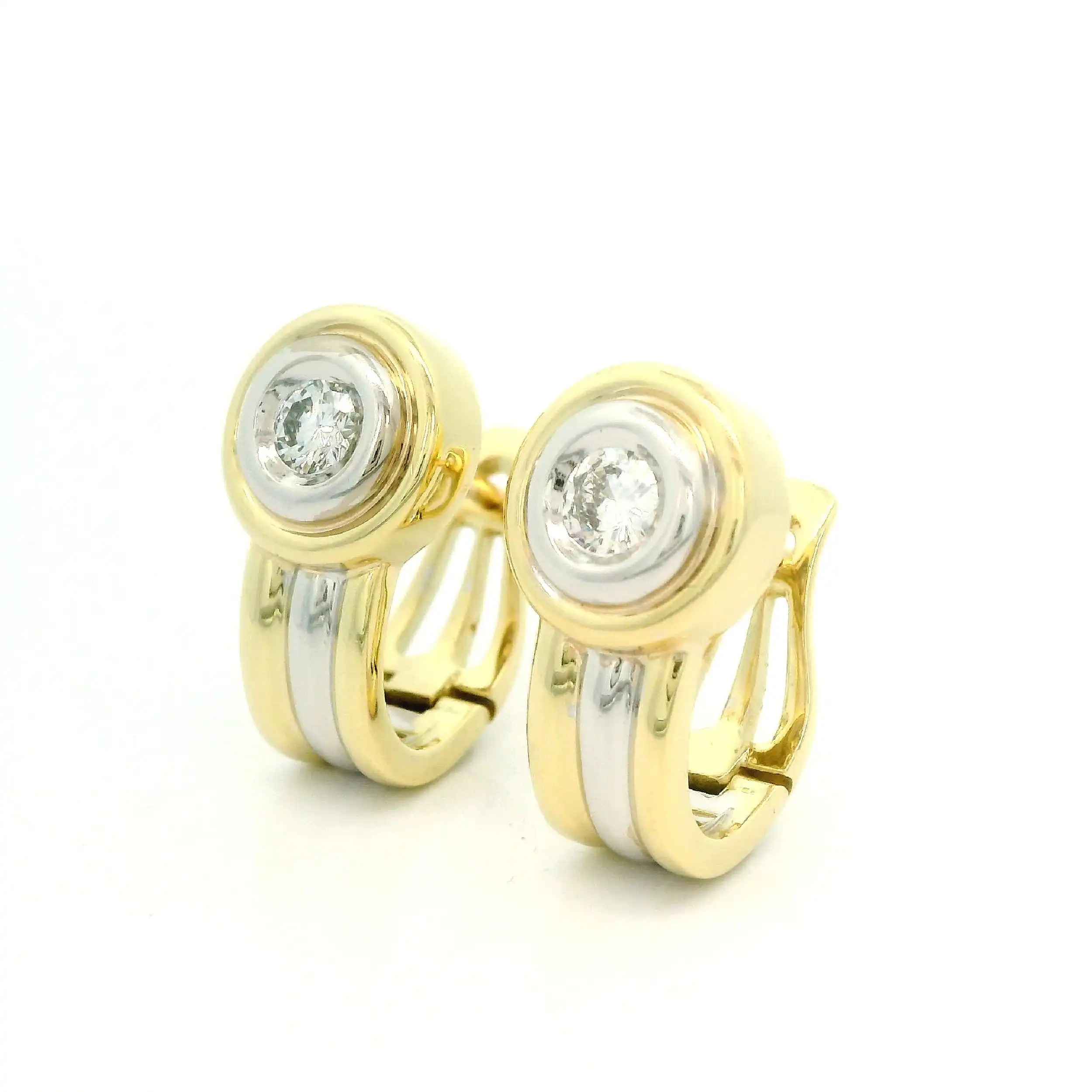 Ohrclips Bicolor mit Brillanten, graviert mit 0,17 ct je Seite Ohrclips Bicolor mit Brillanten, graviert mit 0,17 ct je Seite