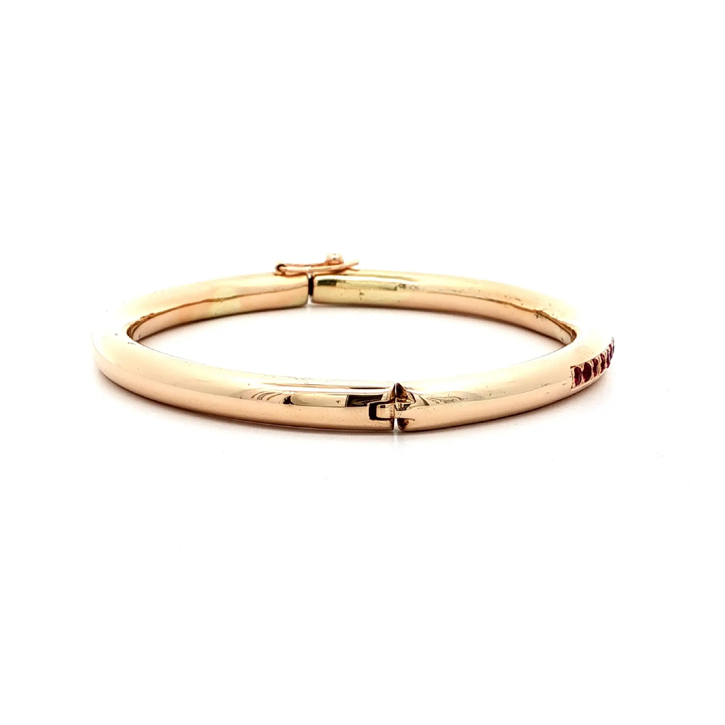 Armreif Gelbgold hohl mit roten Farbsteinen Armreif Gelbgold hohl mit roten Farbsteinen
