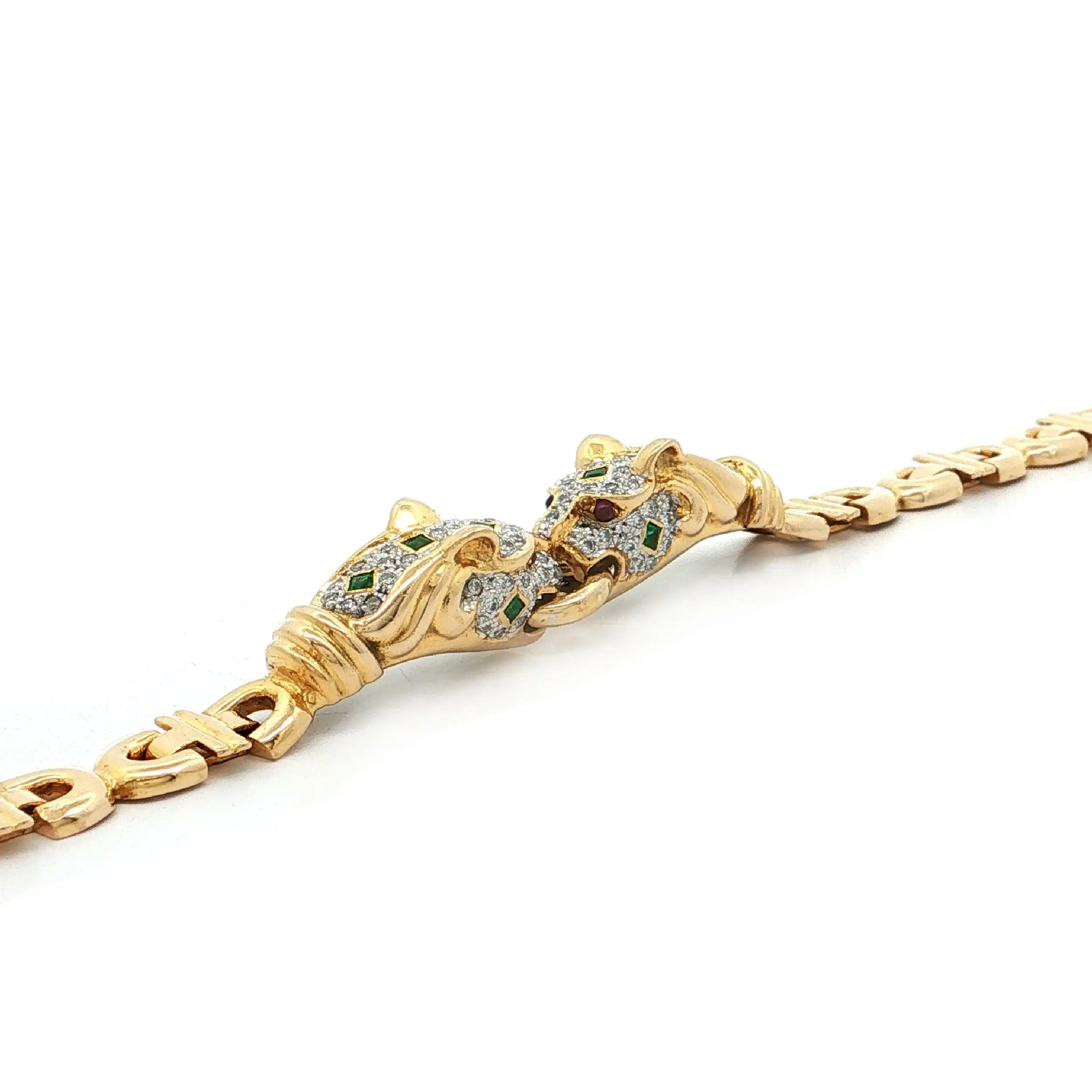 Armband Bicolor mit Brillanten, Smaragden und Rubinen Armband Bicolor mit Brillanten, Smaragden und Rubinen